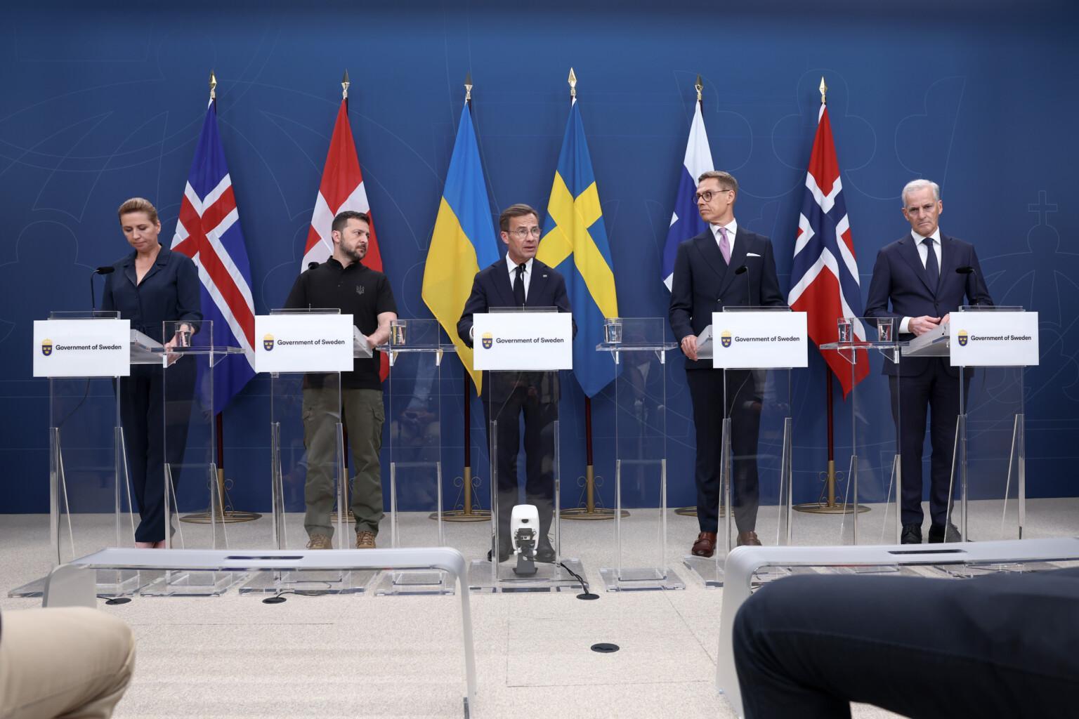 People standing in front of Icelandic, Danish, Ukrainian, Swedish, Finnish and Norwegian flags behind lecterns:
Prime Minister Ulf Kristersson, Sweden
President Alexander Stubb, Finland
Prime Minister Mette Frederiksen, Denmark
Prime Minister Jonas Gahr Støre, Norway
Prime Minister Bjarni Benediktsson, Iceland
President Volodymyr Zelenskyy, Ukraine