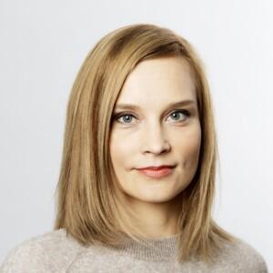 Photo of Sinikukka Saari with shoulder-length blonde hair and wearing a knit. 