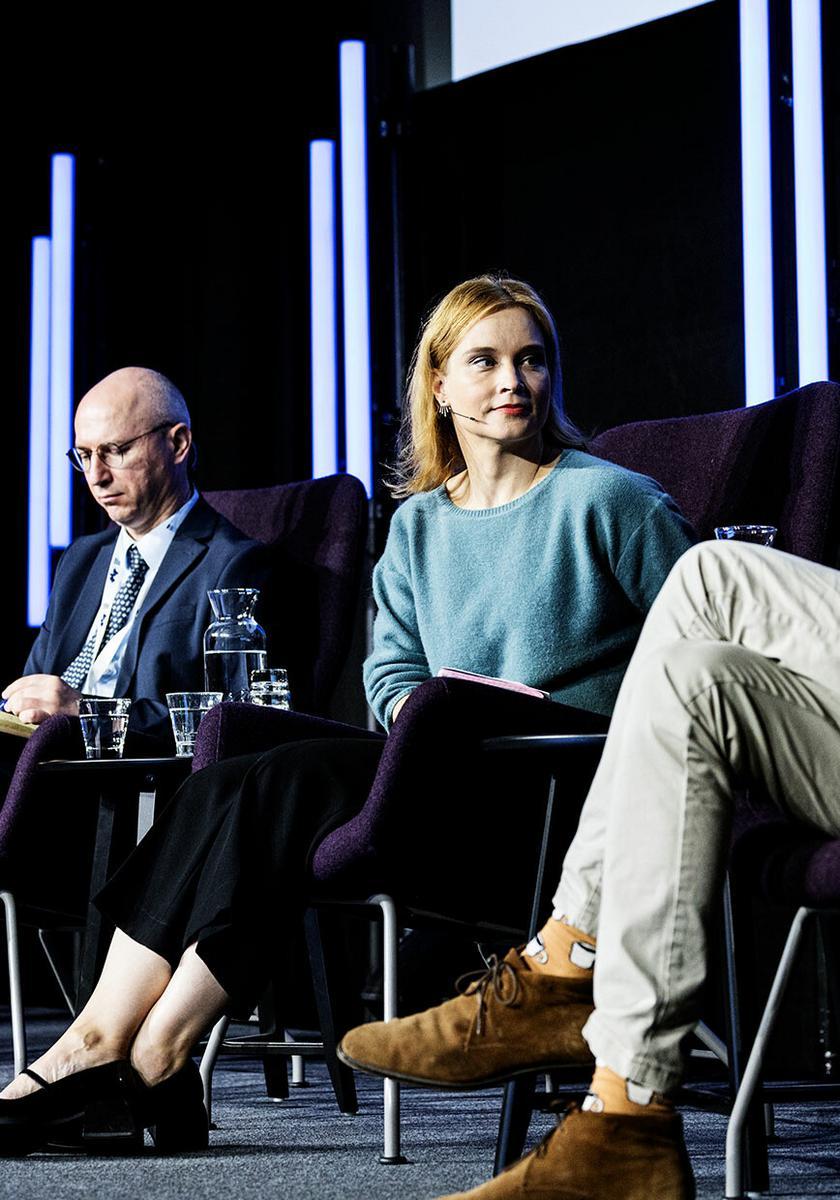 Keir Giles, Stanislav Secrieru, Sinikukka Saari and Henry Foy pictured sitting and talking on stage at the Helsinki Security Forum 2023.