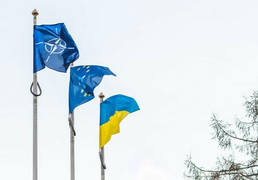 Vilnius, Lithuania - February 16 2022: Flag of NATO, European Union and Ukraine waving together in the sky